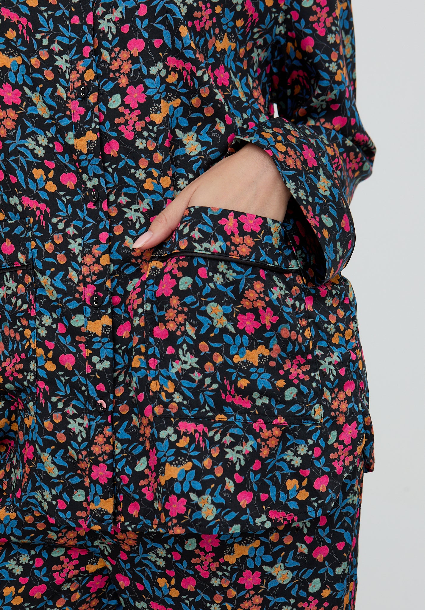 Floral patterned garment with a pocket on a plain background