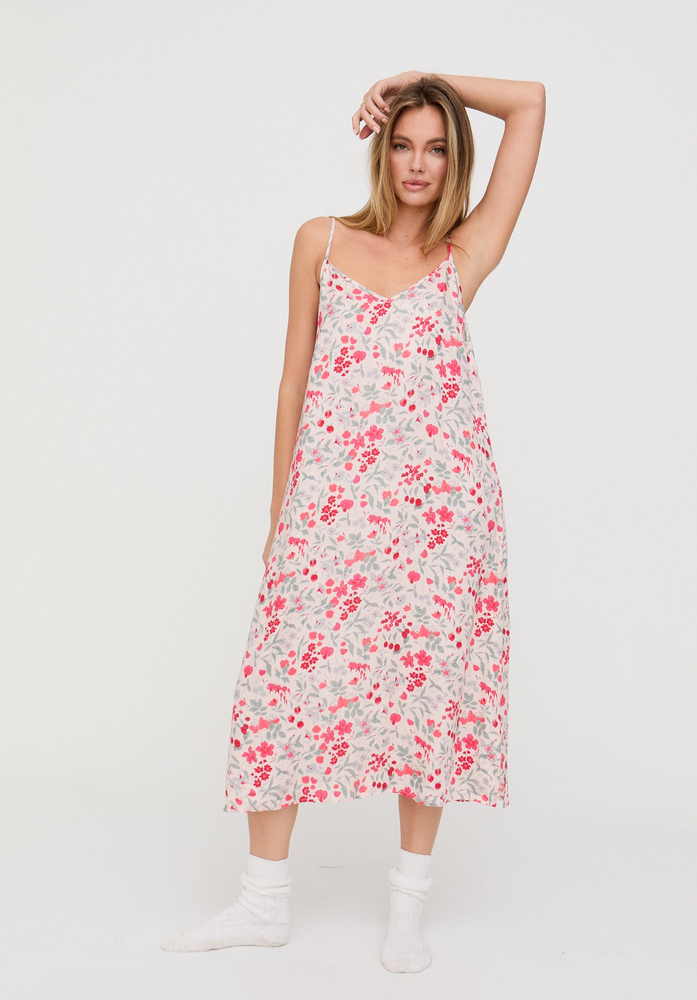 Woman wearing a floral dress on a white background
