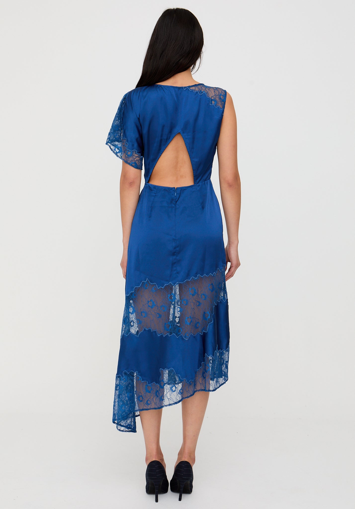 Blue lace dress with cut-out back on a white background