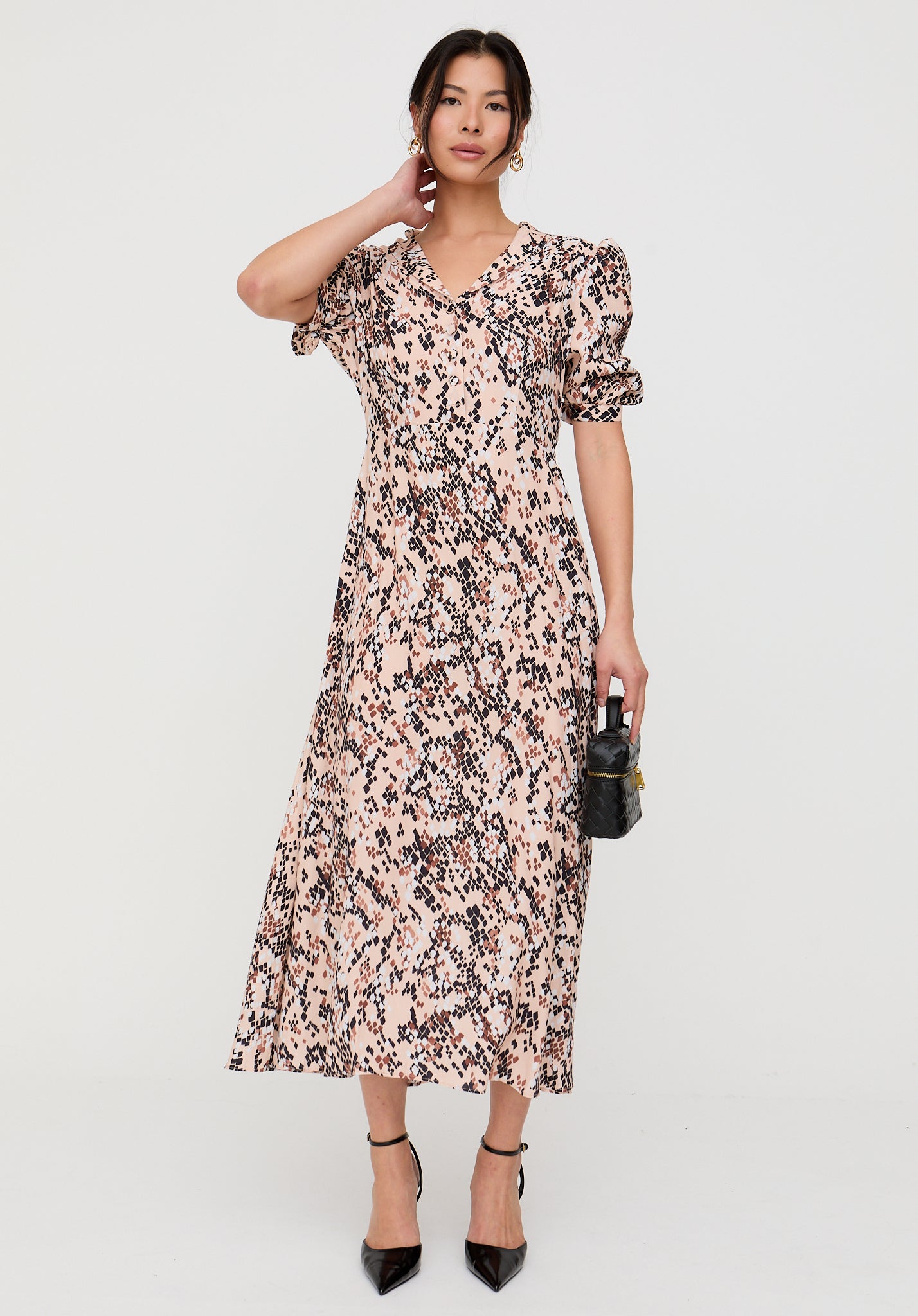 Woman wearing a floral dress on a white background