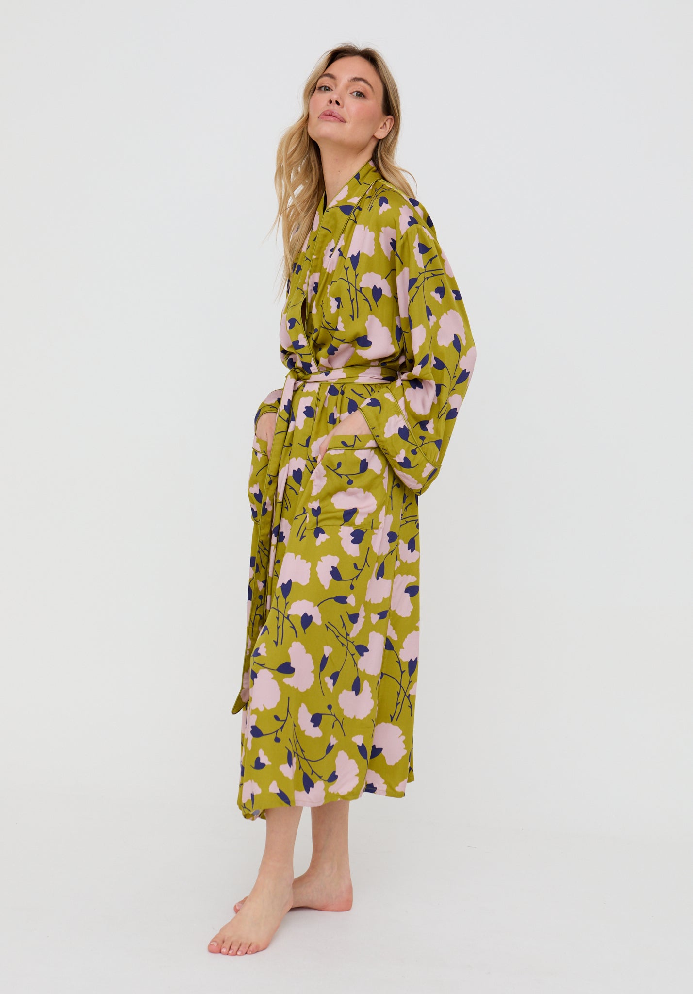 Woman wearing a floral patterned robe on a white background