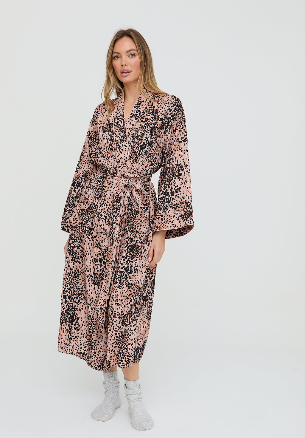 Woman wearing a floral dress on a white background