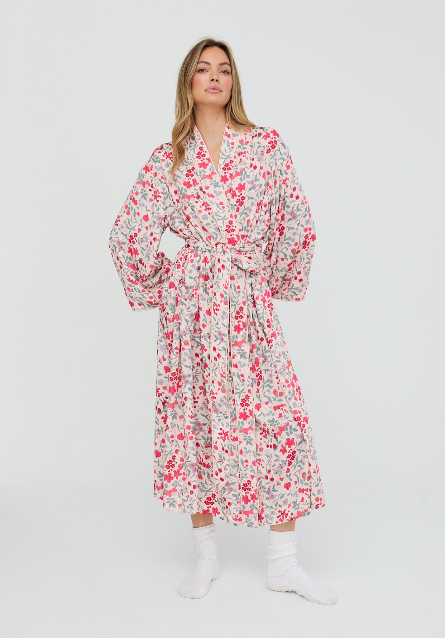 Woman wearing a floral dress on a white background