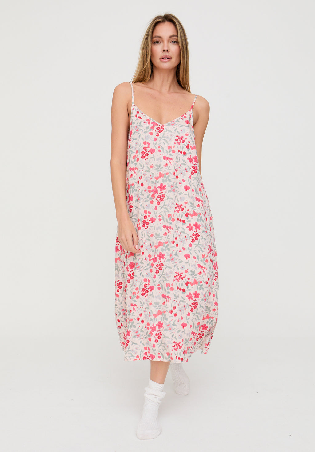 Woman wearing a floral dress on a white background