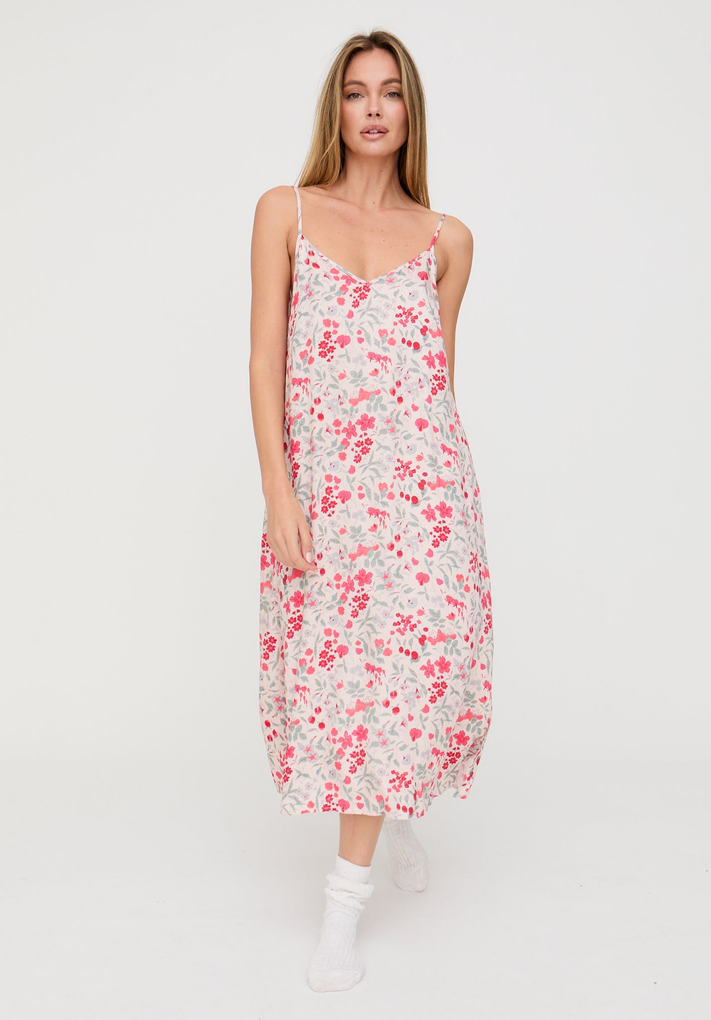 Woman wearing a floral dress on a white background