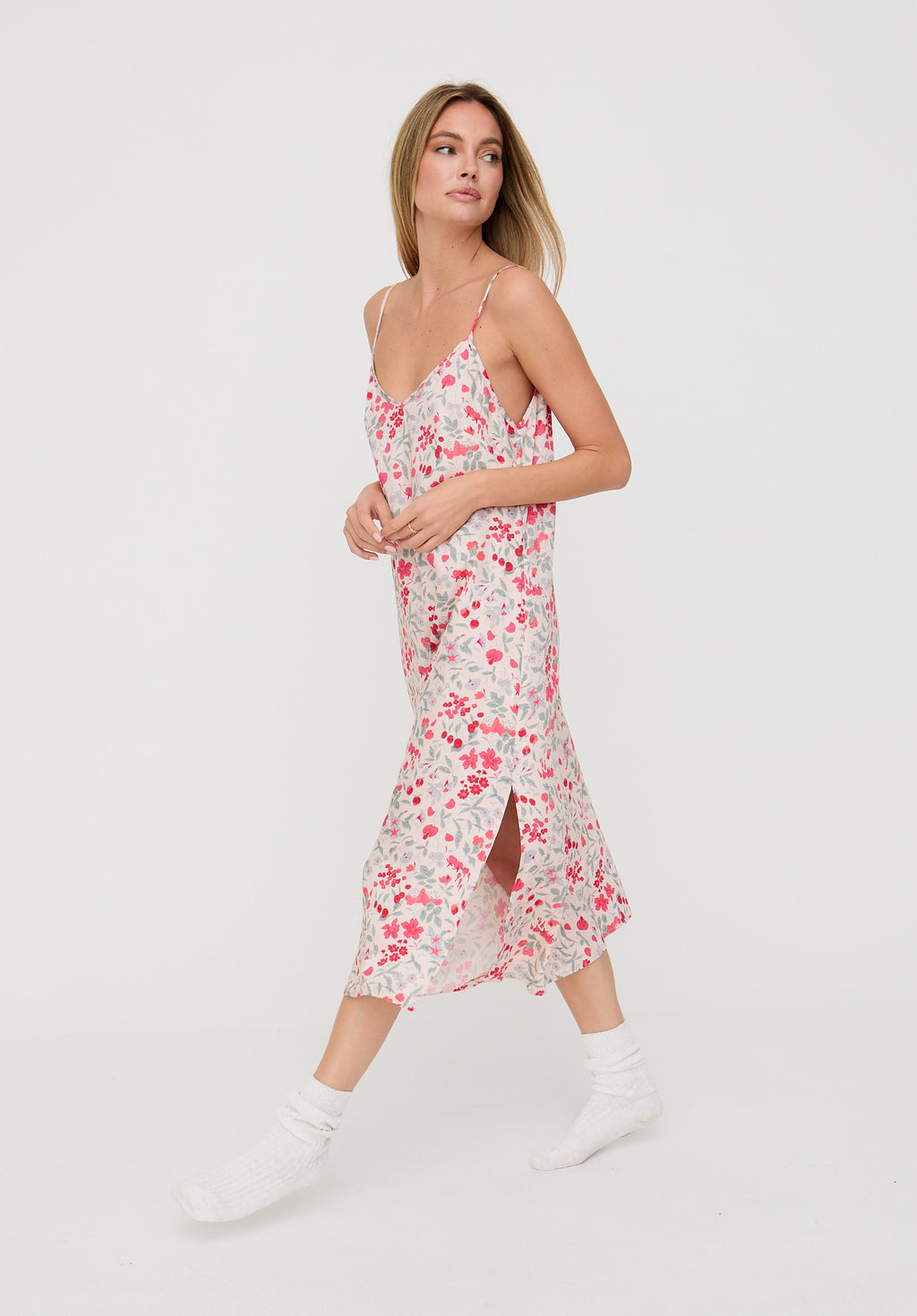 Woman wearing a floral dress on a white background