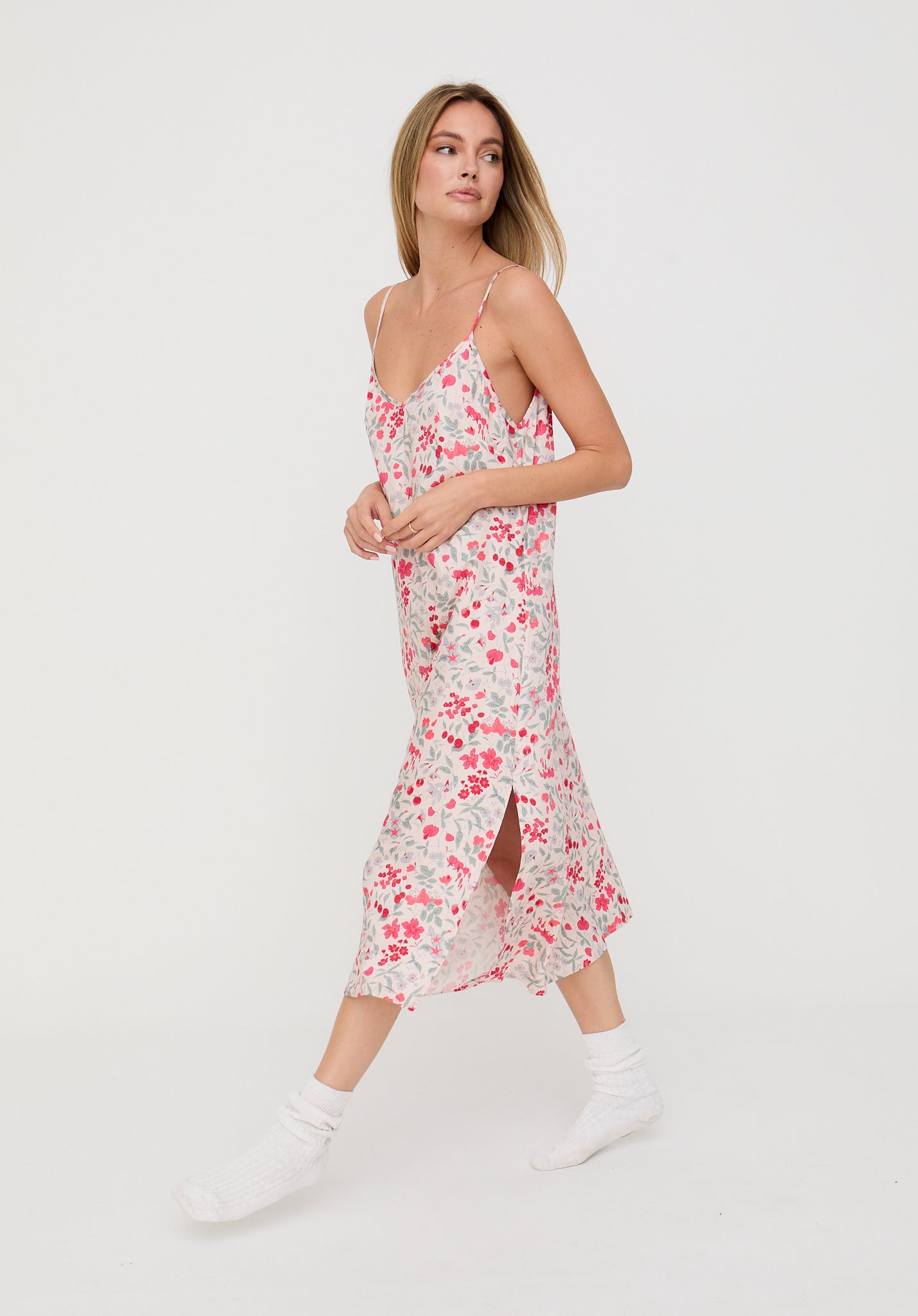 Woman wearing a floral dress on a white background