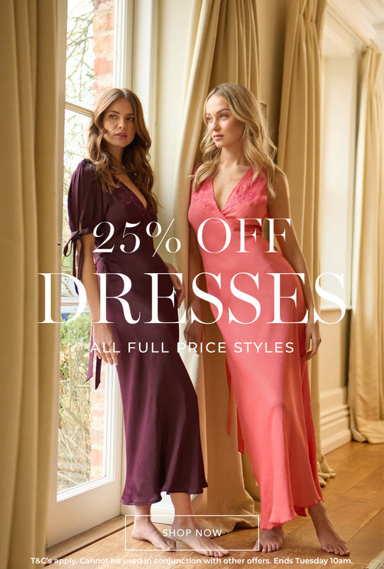 Model on left wears our Princess Bias Cut Embroidered Maxi Dress In Purple. Model on the right is wearing our Pandora Bias Cut Sleeveless Embroidered Maxi Dress In Orange. Copy on image '25% Off Dresses - all full price styles | Shop now'.