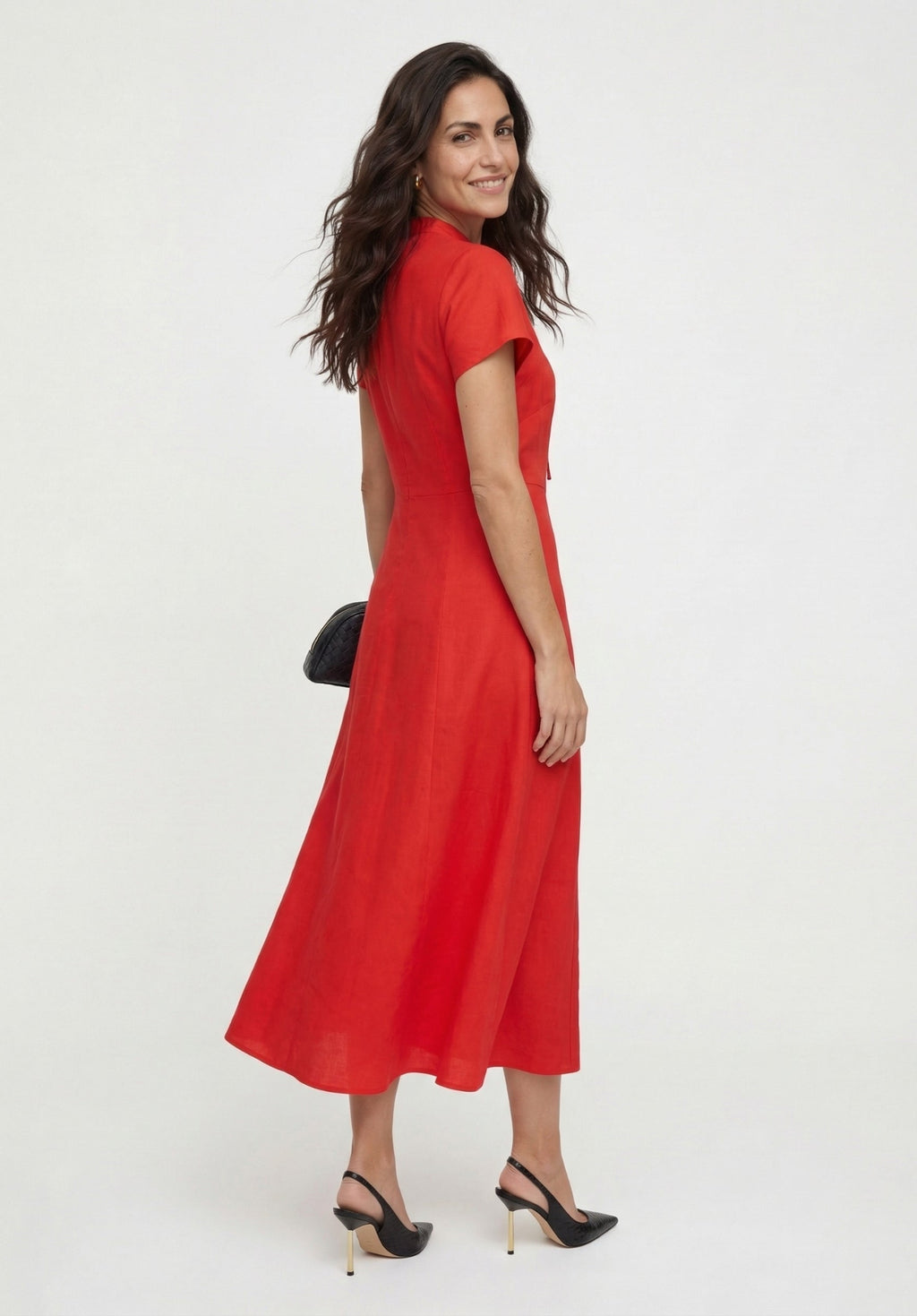 Woman wearing a red dress on a white background