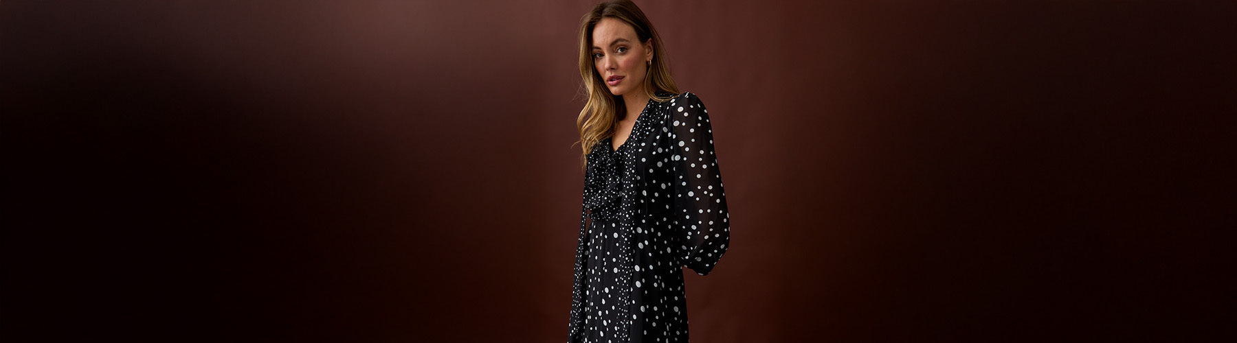 Model wearing the Margot dress in spot print