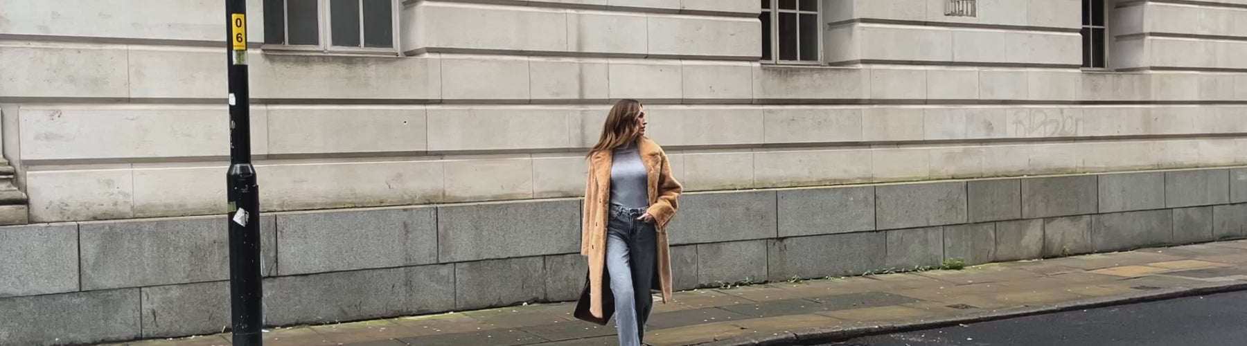 Video showing model wearing Emma Longline Faux Fur Coat In brown 